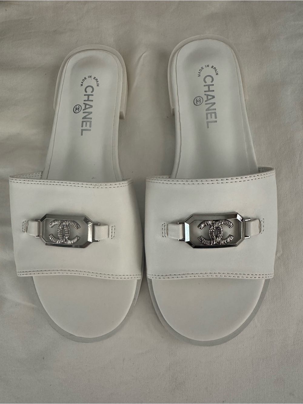 CHANEL White Leather Slide Mules with Silver CC Medallions